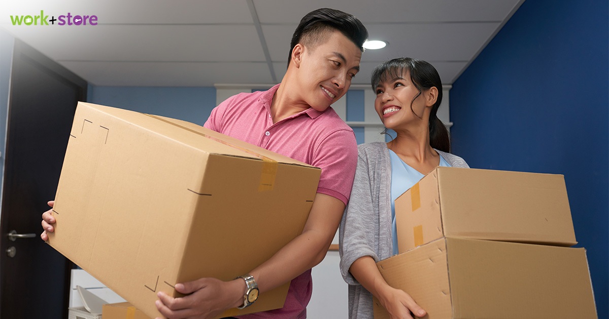 Couple Loading Items into Storage Space